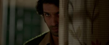 Movie still from “A Death in the Gunj” (2016), directed by Konkona Sen Sharma – A person looking at the camera; Close Up shot, Low angle