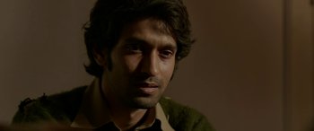 Movie still from “A Death in the Gunj” (2016), directed by Konkona Sen Sharma – A person wearing a green shirt; Close Up shot, Low angle