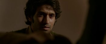 Movie still from “A Death in the Gunj” (2016), directed by Konkona Sen Sharma – A person looking at the camera; Extreme Close Up shot, Over the shoulder angle