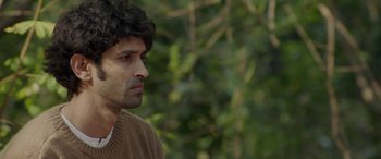 Movie still from “A Death in the Gunj” (2016), directed by Konkona Sen Sharma – A person wearing a sweater; Close Up shot, Over the shoulder angle