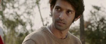 Movie still from “A Death in the Gunj” (2016), directed by Konkona Sen Sharma – A person wearing a sweater; Close Up shot, Low angle