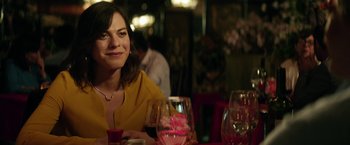 Movie still from “A Fantastic Woman” (2017), directed by Sebastián Lelio – A woman sitting at a table with a glass of wine; Close Up shot, Over the shoulder angle