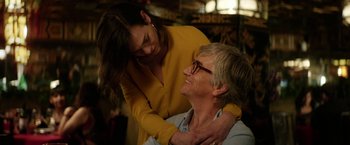 Movie still from “A Fantastic Woman” (2017), directed by Sebastián Lelio – An older man and a younger woman are smiling; Medium shot, Over the shoulder angle