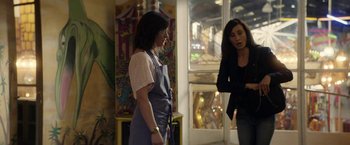 Movie still from “A Fantastic Woman” (2017), directed by Sebastián Lelio – Two women standing next to each other in front of a window; Medium shot, Over the shoulder angle