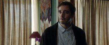 Movie still from “A Fantastic Woman” (2017), directed by Sebastián Lelio – A person standing in a room; Close Up shot, Over the shoulder angle