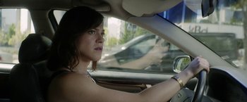 Movie still from “A Fantastic Woman” (2017), directed by Sebastián Lelio – A woman sitting in the driver's seat of a car; Close Up shot, Over the shoulder angle