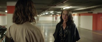 Movie still from “A Fantastic Woman” (2017), directed by Sebastián Lelio – A woman standing in a parking garage looking at another woman; Medium shot, Over the shoulder angle