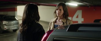 Movie still from “A Fantastic Woman” (2017), directed by Sebastián Lelio – A woman is talking to another woman in a parking lot; Close Up shot, Over the shoulder angle