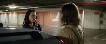 Movie still from “A Fantastic Woman” (2017), directed by Sebastián Lelio – Two women in a parking lot talking to each other; Medium shot, Over the shoulder angle