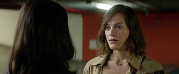 Movie still from “A Fantastic Woman” (2017), directed by Sebastián Lelio – A woman is looking at the camera in the mirror; Close Up shot, Over the shoulder angle