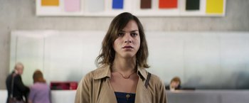 Movie still from “A Fantastic Woman” (2017), directed by Sebastián Lelio – A young woman with brown hair wearing a brown jacket; Close Up shot, Low angle