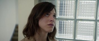 Movie still from “A Fantastic Woman” (2017), directed by Sebastián Lelio – A person with long brown hair; Close Up shot, Low angle