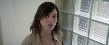 Movie still from “A Fantastic Woman” (2017), directed by Sebastián Lelio – A person wearing a jacket; Close Up shot, Over the shoulder angle