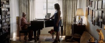 Movie still from “A Fantastic Woman” (2017), directed by Sebastián Lelio – A woman standing in front of an open piano; Wide shot, Over the shoulder angle