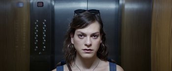 Movie still from “A Fantastic Woman” (2017), directed by Sebastián Lelio – A person wearing a pair of sunglasses; Close Up shot, Low angle