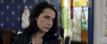 Movie still from “A Fantastic Woman” (2017), directed by Sebastián Lelio – A person with long black hair; Close Up shot, Over the shoulder angle