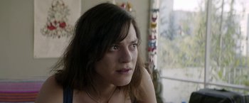 Movie still from “A Fantastic Woman” (2017), directed by Sebastián Lelio – A person with long brown hair; Close Up shot, Over the shoulder angle