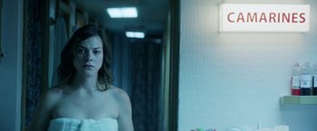 Movie still from “A Fantastic Woman” (2017), directed by Sebastián Lelio – A woman standing in front of a bathroom mirror; Close Up shot, Over the shoulder angle