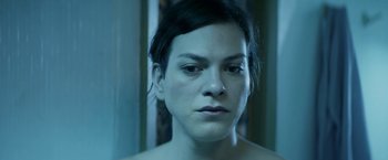Movie still from “A Fantastic Woman” (2017), directed by Sebastián Lelio – A person's face in a room; Close Up shot, High angle
