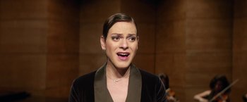 Movie still from “A Fantastic Woman” (2017), directed by Sebastián Lelio – A woman with short brown hair wearing a black jacket; Close Up shot, Over the shoulder angle