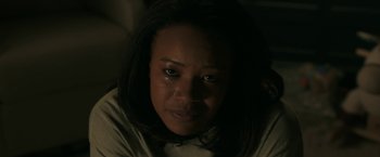 Movie still from “A Journal for Jordan” (2021), directed by Denzel Washington – A person looking at the camera; Close Up shot, High angle