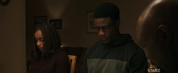 Movie still from “A Journal for Jordan” (2021), directed by Denzel Washington – A man sitting at a table in front of a woman; Medium shot, Over the shoulder angle