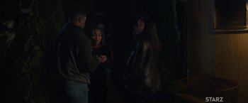 Movie still from “A Journal for Jordan” (2021), directed by Denzel Washington – A group of people standing in a dark room; Wide shot, High angle