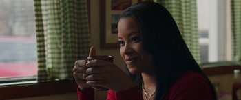 Movie still from “A Journal for Jordan” (2021), directed by Denzel Washington – A beautiful young lady holding a coffee cup; Close Up shot, Over the shoulder angle