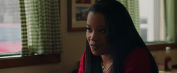 Movie still from “A Journal for Jordan” (2021), directed by Denzel Washington – A person sitting in a room; Close Up shot, Over the shoulder angle