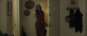 Movie still from “A Journal for Jordan” (2021), directed by Denzel Washington – A woman standing in front of an open door; Medium shot, Over the shoulder angle