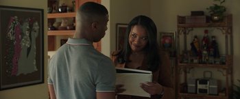 Movie still from “A Journal for Jordan” (2021), directed by Denzel Washington – A man and a woman looking at each other; Medium shot, Over the shoulder angle