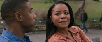 Movie still from “A Journal for Jordan” (2021), directed by Denzel Washington – A man and a woman standing next to each other; Close Up shot, Over the shoulder angle