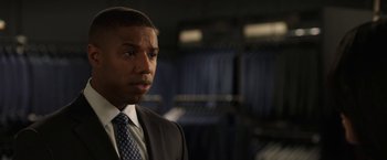 Movie still from “A Journal for Jordan” (2021), directed by Denzel Washington – A man in a suit and a tie; Close Up shot, Over the shoulder angle