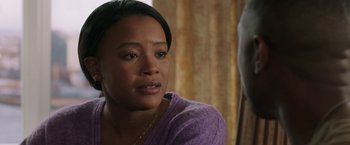 Movie still from “A Journal for Jordan” (2021), directed by Denzel Washington – A person wearing a purple shirt; Close Up shot, Over the shoulder angle