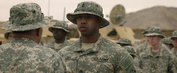 Movie still from “A Journal for Jordan” (2021), directed by Denzel Washington – A group of men standing next to each other in fatigues; Close Up shot, Over the shoulder angle