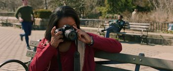 Movie still from “A Journal for Jordan” (2021), directed by Denzel Washington – A woman taking a picture with a camera; Close Up shot, Over the shoulder angle