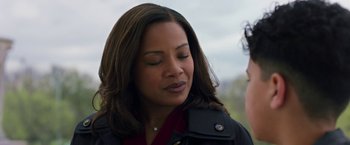 Movie still from “A Journal for Jordan” (2021), directed by Denzel Washington – A person with her eyes closed; Close Up shot, Over the shoulder angle