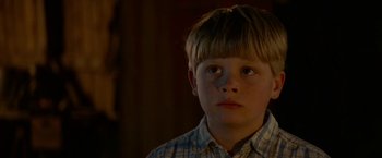 Movie still from “A Man Called Ove” (2015), directed by Hannes Holm – A young boy is looking up at the ceiling; Close Up shot, Low angle