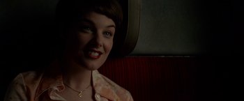 Movie still from “A Man Called Ove” (2015), directed by Hannes Holm – A person sitting on a train; Close Up shot, Over the shoulder angle