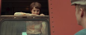 Movie still from “A Man Called Ove” (2015), directed by Hannes Holm – A woman leaning out of a window of a train car; Medium shot, Low angle