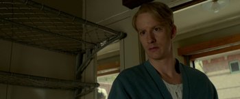 Movie still from “A Man Called Ove” (2015), directed by Hannes Holm – A man standing in front of a window in a room; Close Up shot, Low angle