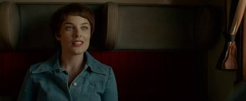 Movie still from “A Man Called Ove” (2015), directed by Hannes Holm – A woman sitting on a train looking at the camera; Close Up shot, Over the shoulder angle