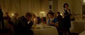 Movie still from “A Man Called Ove” (2015), directed by Hannes Holm – A man and a woman sitting at a dinner table; Medium shot, Over the shoulder angle
