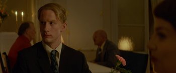 Movie still from “A Man Called Ove” (2015), directed by Hannes Holm – A man sitting at a table in front of another man; Close Up shot, Over the shoulder angle