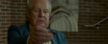 Movie still from “A Man Called Ove” (2015), directed by Hannes Holm – An older man holding a piece of food in his hand; Close Up shot, Low angle