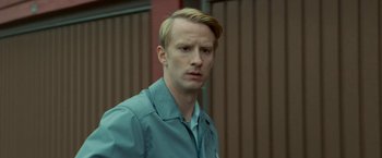 Movie still from “A Man Called Ove” (2015), directed by Hannes Holm – A man with blonde hair and a blue shirt; Close Up shot, Low angle