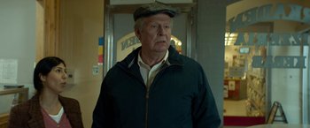 Movie still from “A Man Called Ove” (2015), directed by Hannes Holm – An older man wearing a hat and jacket; Close Up shot, Low angle