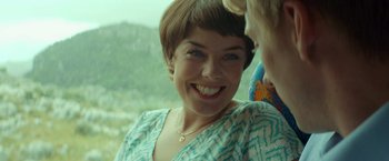 Movie still from “A Man Called Ove” (2015), directed by Hannes Holm – A person with a smile on their face; Close Up shot, Over the shoulder angle