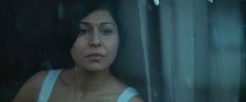 Movie still from “A Man Called Ove” (2015), directed by Hannes Holm – A person looking out a window; Close Up shot, High angle