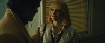 Movie still from “A Most Violent Year” (2014), directed by J.C. Chandor – A woman in a white shirt is looking at a man; Close Up shot, Over the shoulder angle